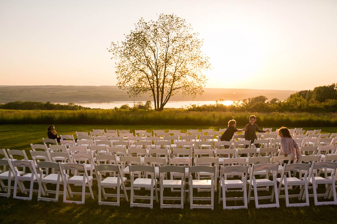 Portfolio 1 From One Of Nyc S Top Wedding Photographers The Sun Setting On Seneca Lake As Children Play Day Before Nate Mitchell